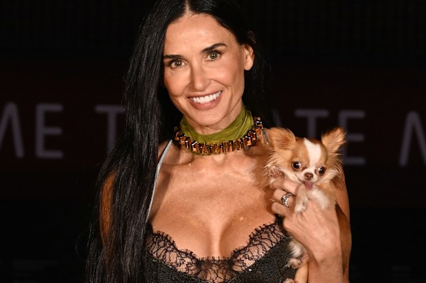 Demi Moore and Pilaf arrives at the Gucci Cruise 2025 Fashion Show at Tate Modern on May 13, 2024 in London, England. 