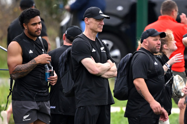 Psychiatrist Ceri Evans (middle) and forwards coach Jason Ryan (right) look on during an All Blacks captain's run.