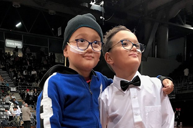 Alec and his twin brother Troy. 