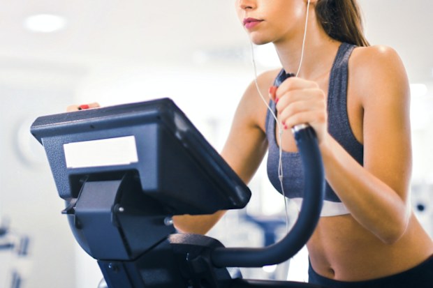 Woman on elliptical at the gym
