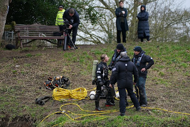 Specialist search teams from Lancashire Police, beside the bench where Nicola Bulley's phone was found, on the banks of the River Wyre, in St Michael's on Wyre, Lancashire.
