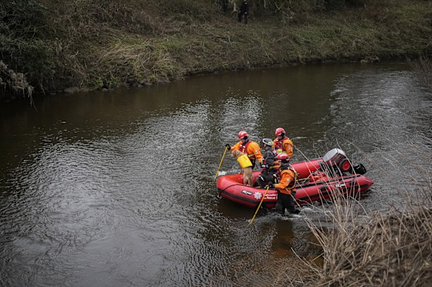 A search dog from Lancashire Police and a crew from Lancashire Fire and Rescue service search the River Wyre for missing woman Nicola Bulley in the village of St Michael's on Wyre, UK.