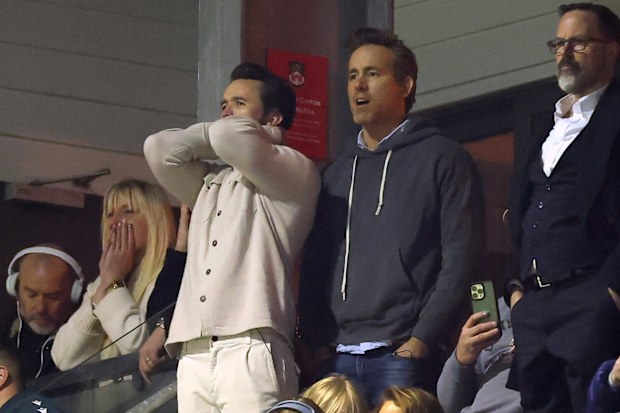 WREXHAM, WALES - MARCH 07: Rob McElhenney, Actor and Co-Owner of Wrexham, Ryan Reynolds, Actor and Co-Owner of Wrexham, and Actress Blake Lively react during the Emirates FA Cup Fifth Round match between Wrexham and Chelsea on March 07, 2026 in Wrexham, Wales. (Photo by Carl Recine/Getty Images)