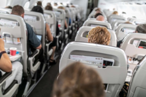 Cabin crew are checking out passengers for safety reasons.