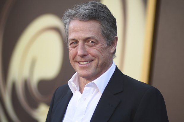 Hugh Grant arrives at the premiere of "Wonka" on Dec. 10, 2023, at Regency Village Theatre in Westwood, California