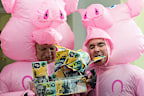 Member for Kennedy, Bob Katter, and Member for Clark, Andrew Wilkie, dressed in pig costumes as they walk through the press gallery, ahead of their press conference on supermarkets, at Parliament House in Canberra on Wednesday 28 February 2024.