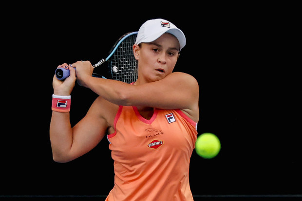 Ash Barty of Australia plays a backhand.