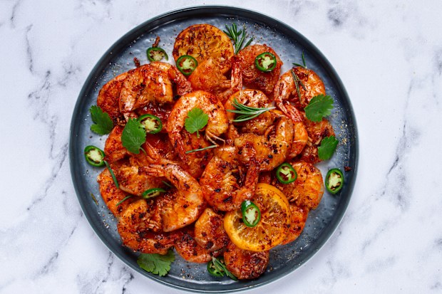 grilled shrimp, unpeeled, headless, with spices, on a marble table, homemade, no people,