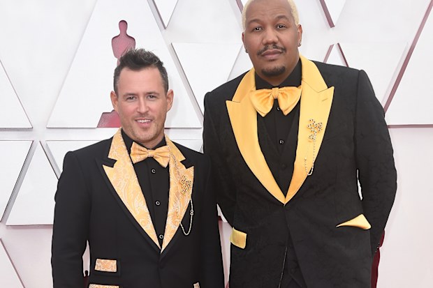 9.20am Travon Free's yellow suit hides special message

Travon Free had something to say on the Oscars red carpet about police brutality.
The writer and performer wore a Dolce & Gabbana yellow suit which featured the names of people killed by police violence.
