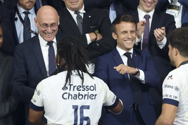 President of French Rugby Federation FFR Bernard Laporte (left) with French President Emmanuel Macron during the trophy ceremony following the Top 14 Final rugby match at Stade de France.
