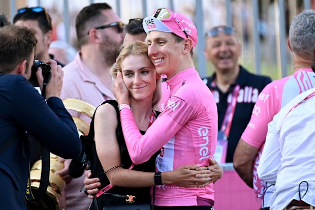 Final overall race winner Tadej Pogacar of Slovenia and UAE Team Emirates - Pink Leader Jersey and his girlfriend Urska Zigart of Slovenia professional cyclist of Team Liv AlUla after the 107th Giro d'Italia 2024, Stage 21.