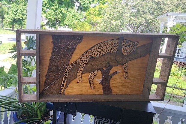 Chuck Perkins's 1980 carving of a cheetah went on a long journey to find its way home. CNN