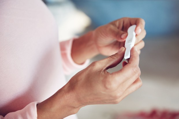 The man was furious when his wife told her friends about her pregnancy before him.
