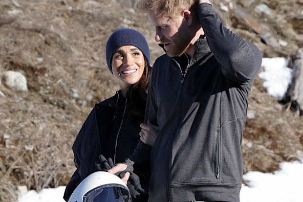 Meghan Markle and Prince Harry walk in the snow at Invictus Games Vancouver Whistlers 2025's One Year To Go Winter Training Camp.