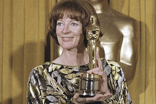 Actress Maggie Smith holds her Oscar 