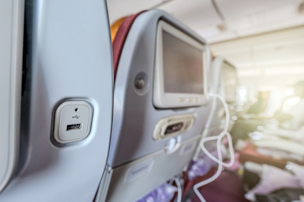 Convenience meets travel with USB ports at airplane seats, providing a practical solution for charging electronic devices on the go.