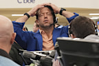 A trader reacts as other traders work on the options trading floor at the Cboe Global Markets in Chicago, Tuesday, April 8, 2025. (AP Photo/Nam Y. Huh)