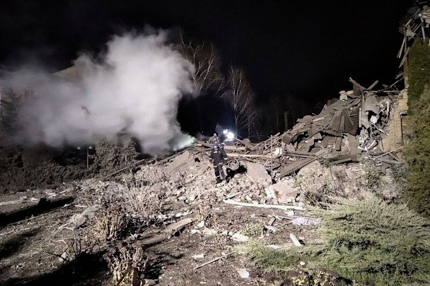 Ukrainian firefighters work at damaged hospital maternity ward in Vilniansk, Zaporizhzhia region, Ukraine, early Wednesday, November 23, 2022.  