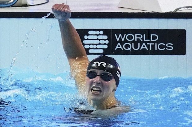 Katie Ledecky celebrates winning her seventh world championship gold medal in the 800m freestyle.