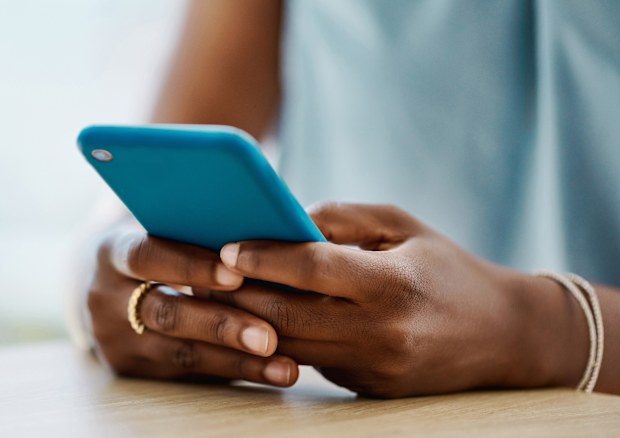 woman using a cellphone stock photo