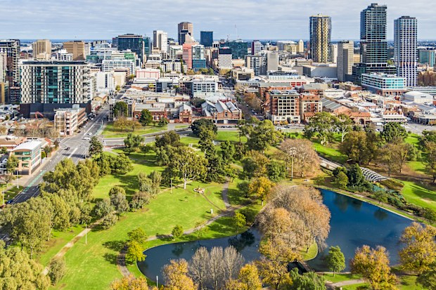 Aerial close view east side of Adelaide with beautiful Rymill Park adjacent in foreground: vibrant green colours, sunny, connection between city and environment, wellbeing, recreation, conservation, autumn colours, fresh air.
