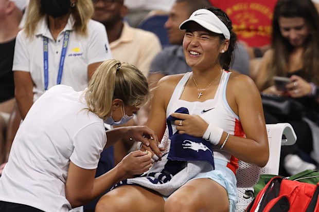 Emma Raducanu of Great Britain receives medical attention against Alize Cornet of France.