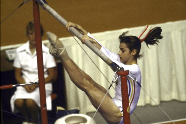 Nadia Comanecia of Romania competing at the Montreal 1976 Olympics, where she became the first gymnast in Olympic history to score a perfect 10.