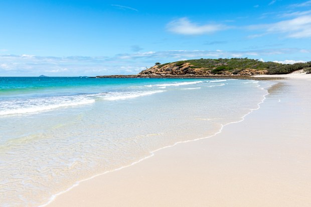 Long beach is one of the many pristine white sand beaches on Keppel Island in  tropical Queensland.