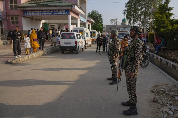 Indian security officers patrol in armored vehicles near Pahalgam in south Kashmir after assailants indiscriminately opened fired at tourists in Pahalgam, Indian controlled Kashmir, Tuesday, April 22, 2025. (AP Photo/Dar Yasin)