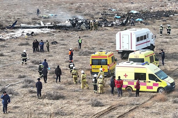 The wreckage of Azerbaijan Airlines Embraer 190 lays on the ground near the airport of Aktau, Kazakhstan, Wednesday, Dec. 25, 2024. (AP Photo/Azamat Sarsenbayev)