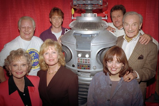 FILE - In this file photo showing the crew from the original cast of the television series "Lost in Space" from left in the back row are: Bob May, Bill Mumy, Mark Goddard, Jonathan Harris; in the front row from left: June Lockhart, Marta Kristen, Angela Cartwright in Boston on Dec. 2, 1995. (AP Photo/Steven Senne, File)