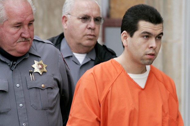 Anthony Sanchez, right, is escorted into a Cleveland County courtroom for a preliminary hearing in Norman, Okla., Feb. 23, 2005