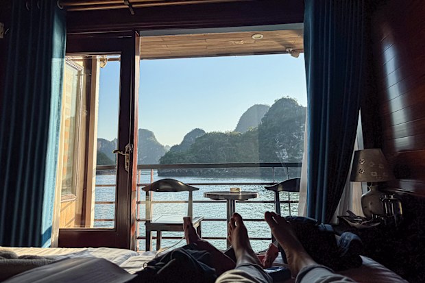 Relaxing in a Cabin with Sea View during a Cruise in Ha Long Bay, Vietnam. High quality photo