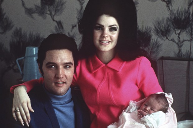 FILE -Elvis Presley poses with wife Priscilla and daughter Lisa Marie, in a room at Baptist hospital in Memphis, Tenn., on Feb. 5, 1968.  Lisa Marie Presley, a singer, Elvis only daughter and a dedicated keeper of her fathers legacy, died Thursday, Jan. 12, 2023 after being hospitalized for a medical emergency. (AP Photo/File)