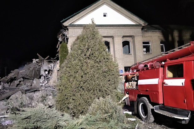 Ukrainian firefighters work at damaged hospital maternity ward in Vilniansk, Zaporizhzhia region, Ukraine, early Wednesday, November 23, 2022. 