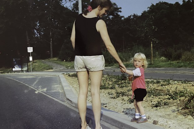 Toddler girl walking with her mother