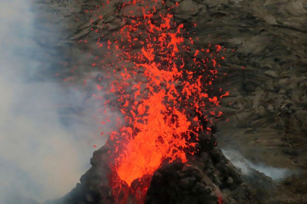 Lava erupts within the summit crater of Kilauea Volcano in Hawaii Volcanoes National Park on Hawaiis Big Island. 