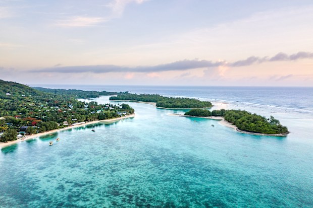 Muri Lagoon at sunrise from an aerial or birds eye view in Rarotonga the main island in the Cook Islands