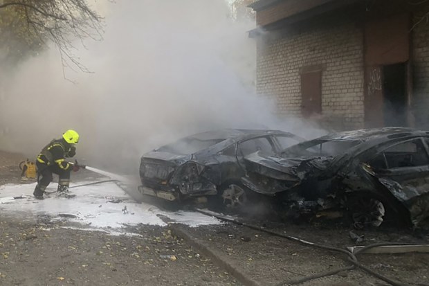 emergency services personnel work to extinguish a fire following a Russian rocket attack in Poltava region, Ukraine, Sunday, Nov. 17, 2024.  