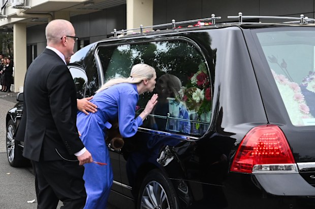 Charlotte's parents farewell a hearse carrying her coffin.