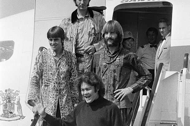 The Monkees arrive at Tokyo International Airport September 30, 1968 for performances in Tokyo, Kyoto, and Osaka.   About 1,000 fans, mostly Japanese teenage girls, gathered at the airport to see members of the group arriving  (from top: Mike Nesmith, David Jones, Peter Tork, hand on hip; and Mickey Dolenz).