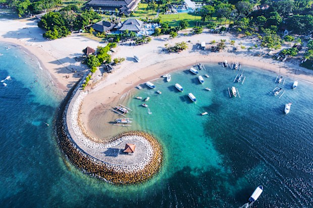 Bali Nusa Dua coast with a figurative breakwater aerial view