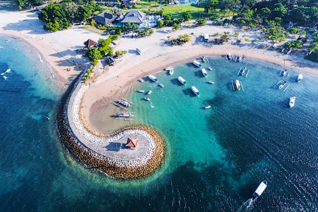 Bali Nusa Dua coast with a figurative breakwater aerial view
