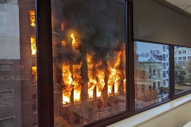 Watching commuters and office workers were left stunned by the blaze.