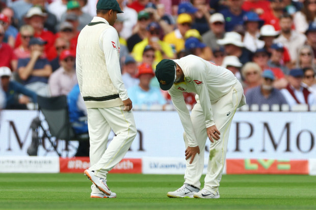 Nathan Lyon clutches his calf on day two of the Ashes Test at Lord's.