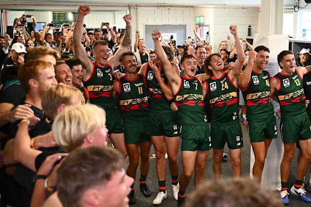 The Tassie Devils celebrate their inaugural VFL victory.