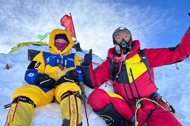 A photo of Grace Tseng and one of the Sherpas who helped her reach the summit of Manaslu in Nepal.