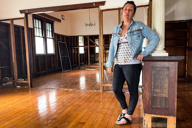 Lismore mum Crystal Lenane in what remains of her home.