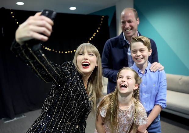 Taylor Swift takes a selfie with Prince William, Prince George and Princess Charlotte at Wembley Stadium, London