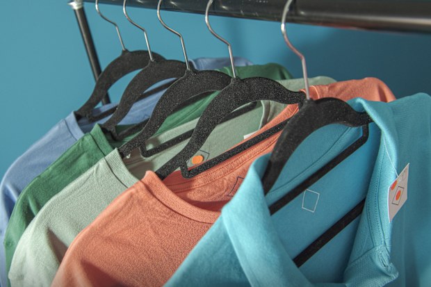 Forgotten clothes in the warehouse are covered with dust